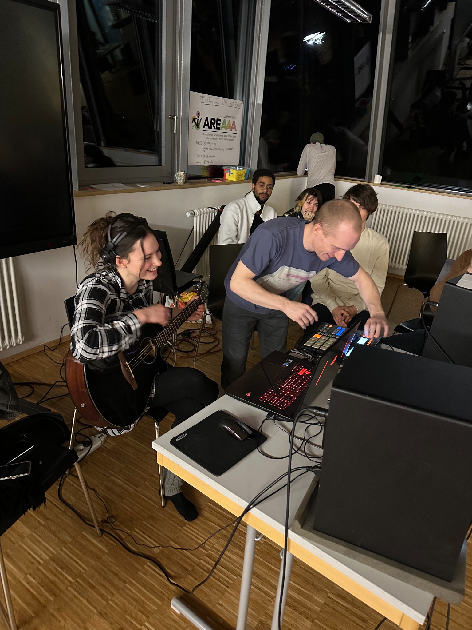Participants creating music and digital content together during an activity